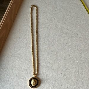 Gold rope chain with lien pendant